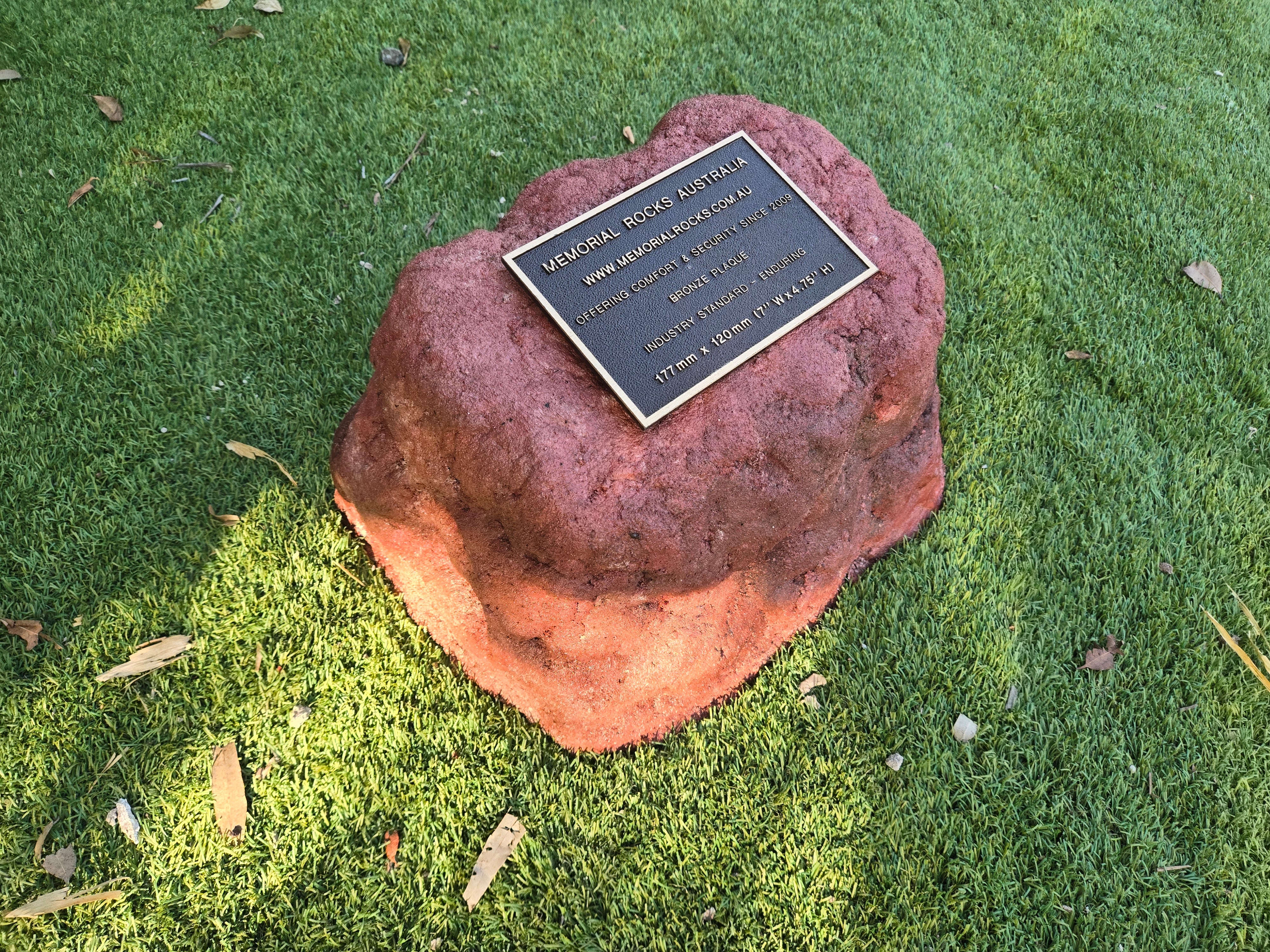 outdoor rock urn and plaque