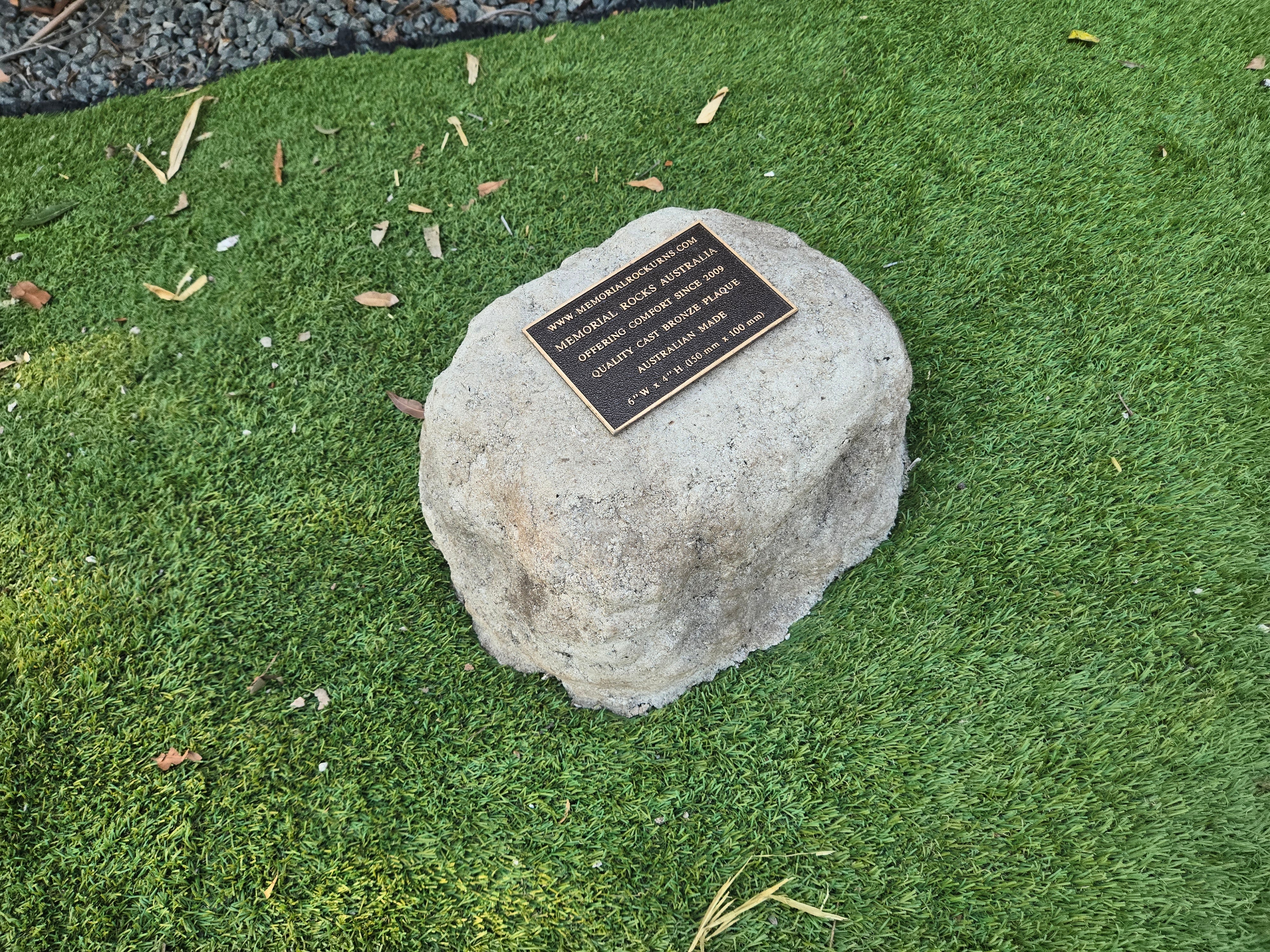 outdoor rock urn and plaque
